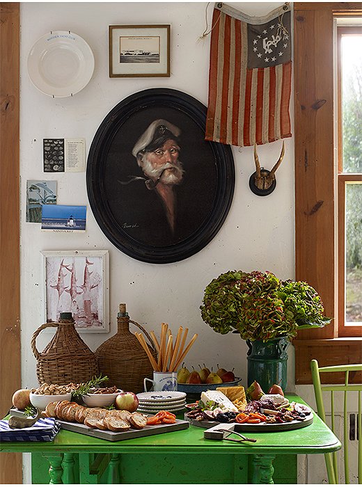 In the kitchen, distract guests who linger with an artful array of cheeses, crackers, and other small bites.
