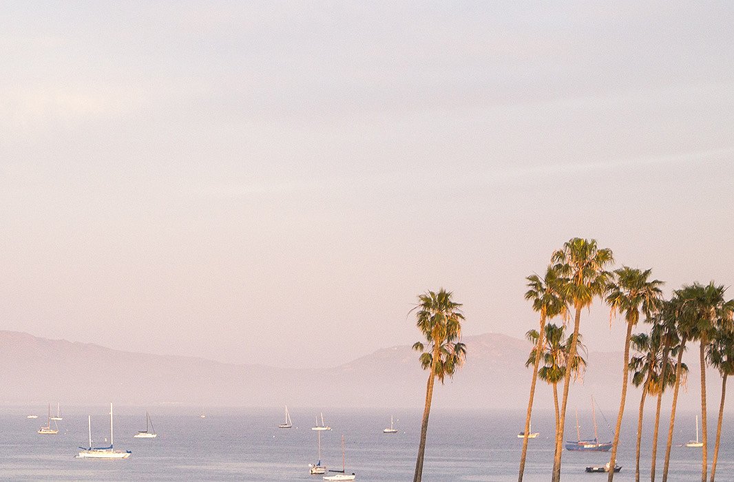 Sailboats float on the Pacific.
