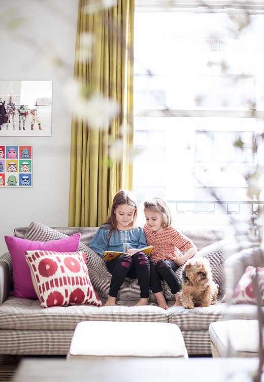 Grace [left] and Daisy [right] pore over a book alongside Mabel, their trusty canine sidekick.
