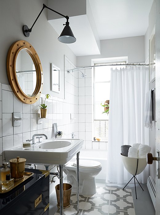 Make an old bathroom feel like new again with a white shower curtain and fresh grout. (Click here for a step-by-step how-to).
