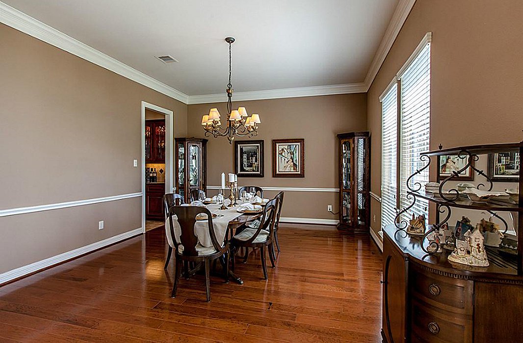 A diminutive chair rail didn’t fit the scale of the dining room.
