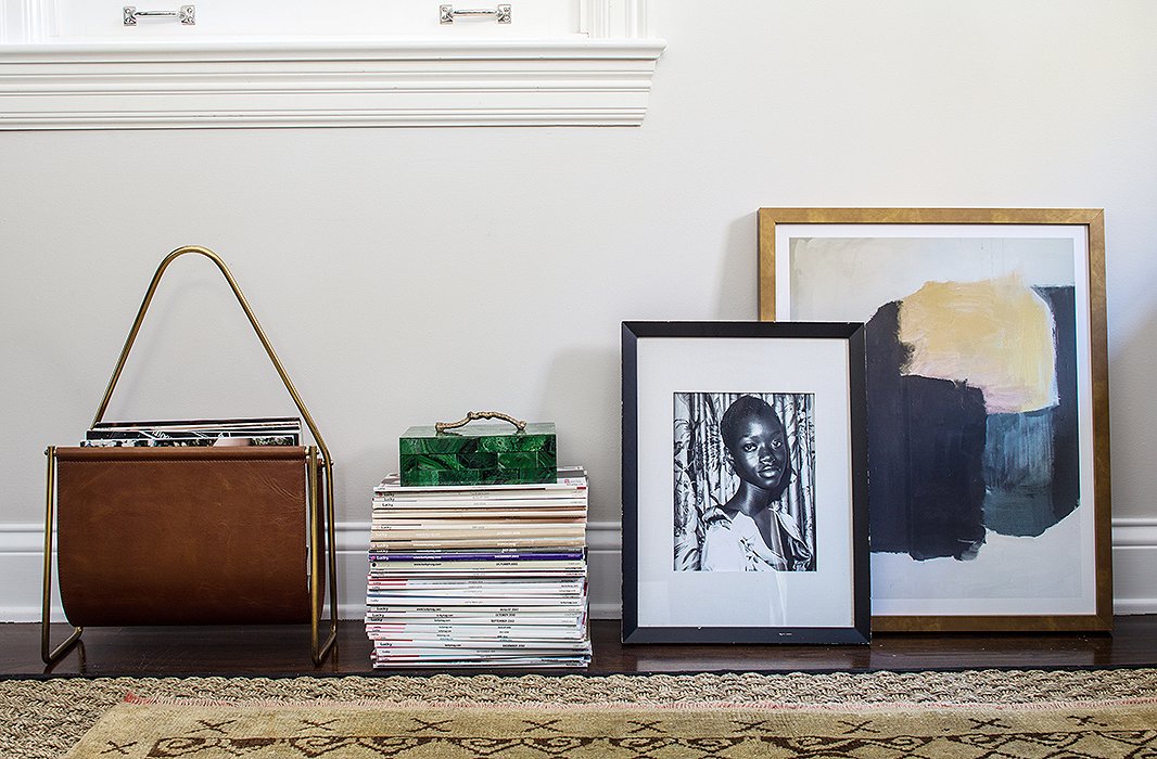 Alex replaced a thick-pile Moroccan rug with two thinner ones—a sea-grass rug (“so easy, durable, and inexpensive,” he says) underneath an antique Oushak that reflects the office’s palette of tan, black, and specks of gray.

