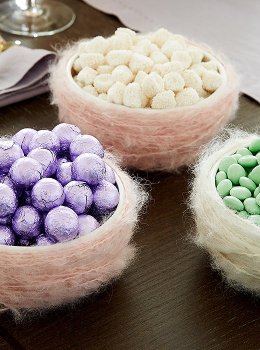 A few handmade touches will add charm and whimsy to your Easter fete—but they don’t have to be complicated. Dylan loves these “nests” filled with foil-wrapped eggs and gummies, made by simply wrapping bowls with pastel yarn.
