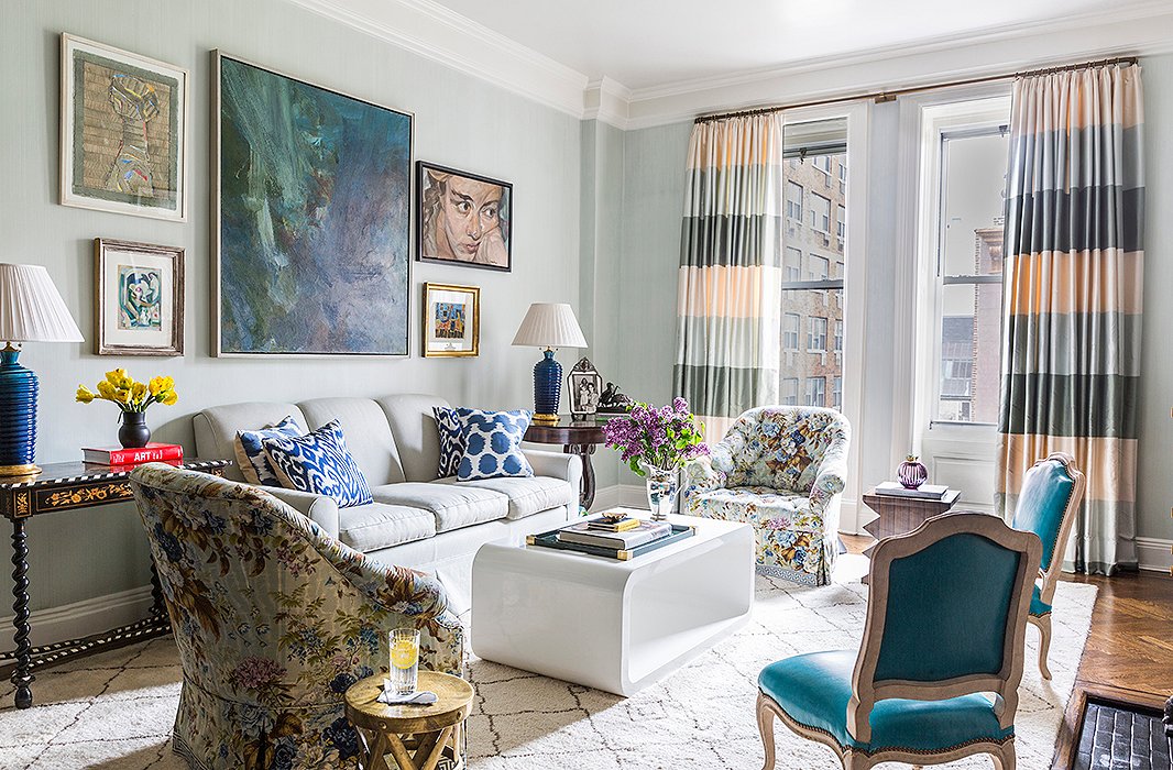 A bold, oversize abstract is a strong anchor for a room filled with atmospheric blue hues. Photo by Lesley Unruh.
