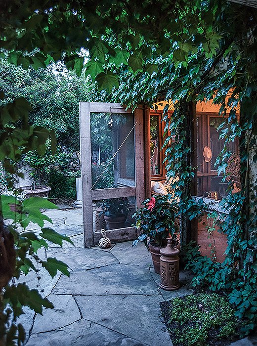 The ivy-covered screened porch is one of the Minnises’ favorite things about their home. 
