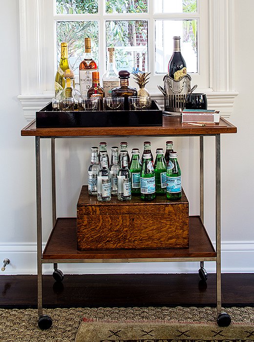 No office bar is complete without bottles of water—an easy grab during any meeting. Alex completed the look with malachite matchboxes and a brass pineapple.
