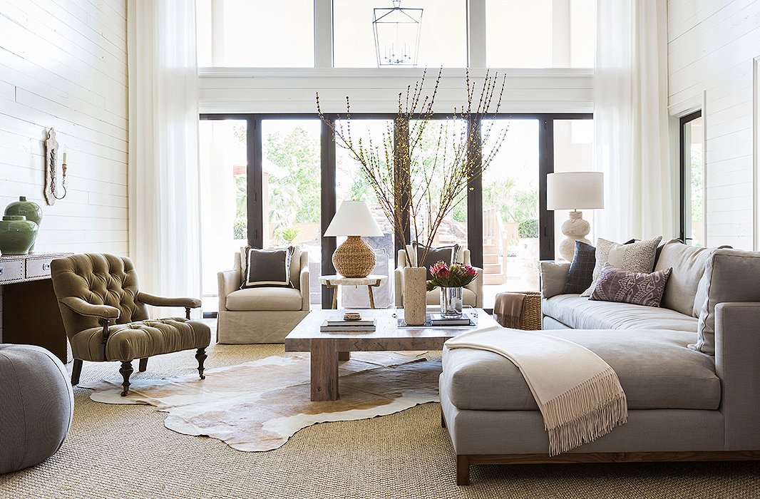 The home’s large lot allowed Marie and her team to close off part of the back patio, creating a new double-height family room. Find similar hide rugs here. Photo by Julie Soefer.
