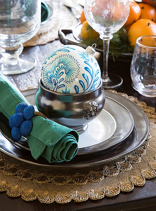 Eileen accented the dining room’s blue-and-white scheme with pewter, not silver, for an elegant yet approachable look. “The matte finish of pewter makes the setup feel a little more modern and laid-back,” she says. 
