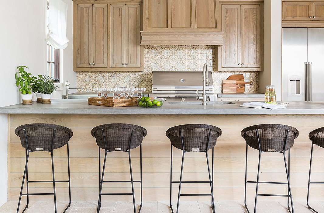 The addition included a kitchen off the new patio, built to encourage indoor-outdoor living year-round. Photo by Julie Soefer.
