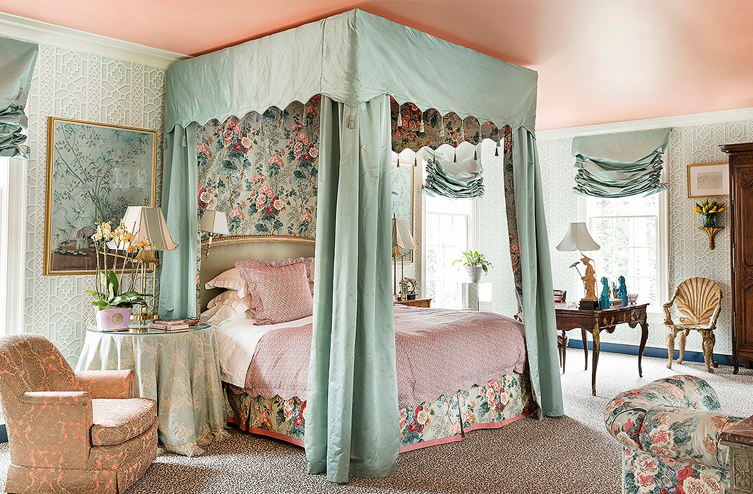 In the master bedroom, which is wrapped in Schumacher’s Zanzibar Trellis paper, Danielle crafted the bed of her dreams with satin canopy lined in Lee Jofa chintz. 
