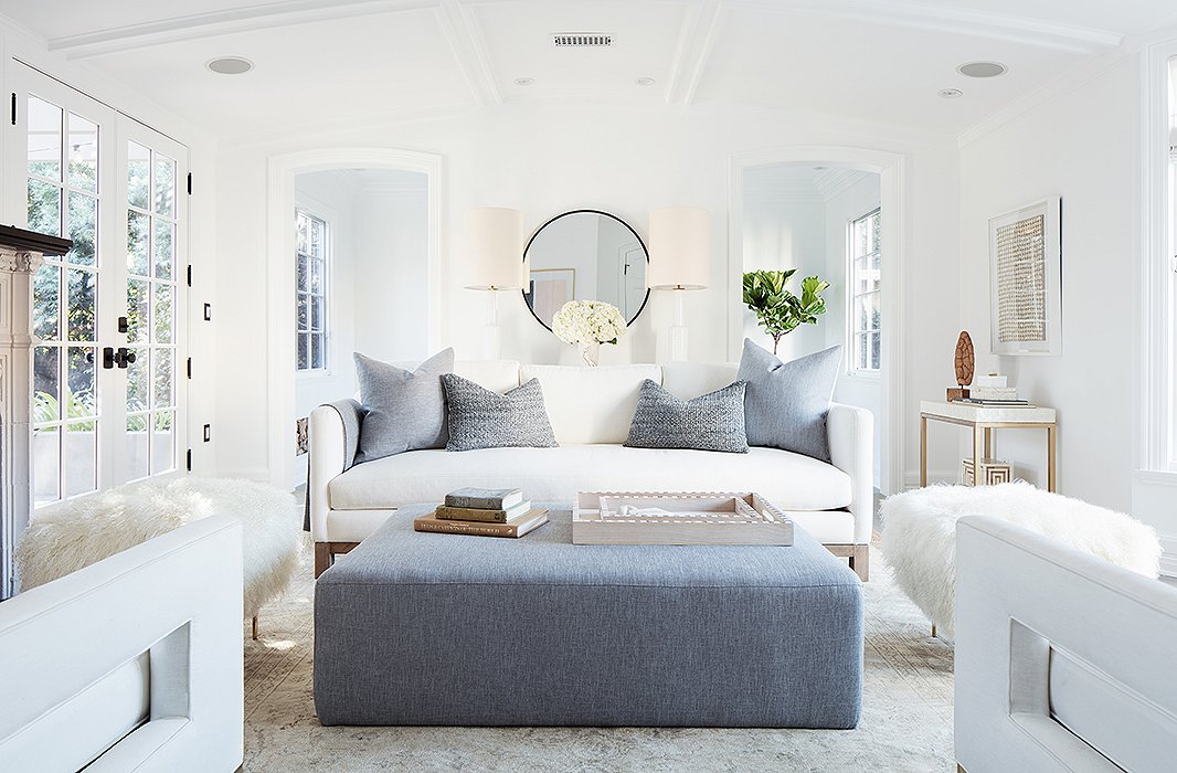 “I wanted every wall to make sense, to have its own vignette,” says Alex. It’s also a flexible design scheme—the ottoman adds extra seating and can be “scooched up for cozier conversations during parties.”
