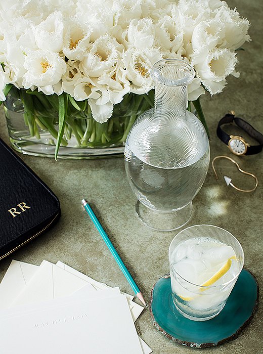 Agate coasters, another One Kings Lane find, add to the turquoise notes in Rachel’s office. “I like pops of color but ones that blend as opposed to standing out,” she says. “And I’m currently in love with fringed tulips.”
