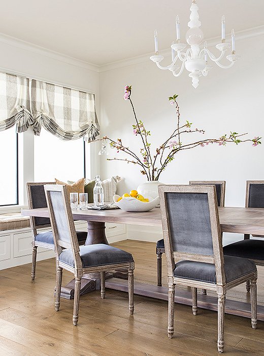 The team added a built-in window bench to maximize seating in the sunny breakfast nook. Photo by Julie Soefer.
