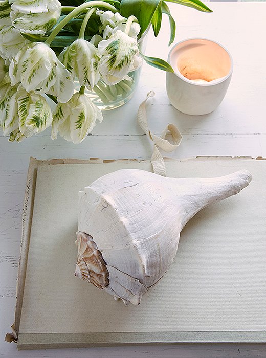 A tea light, a seashell, and a notebook jotted with ideas: These are things Foley loves.
