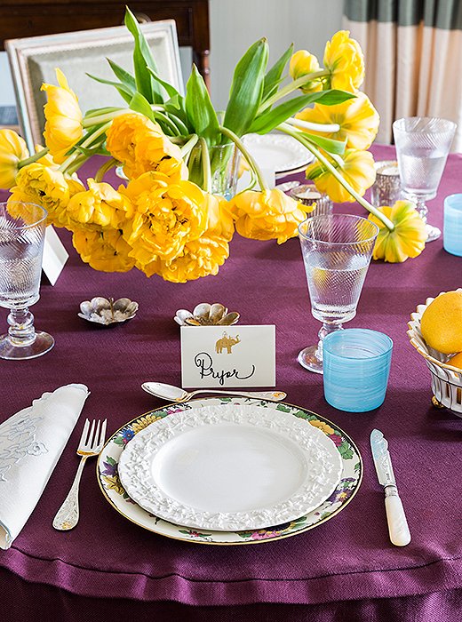 CeCe’s small-space vice of choice? Tableware. “I have an entire closet dedicated to china and silver, which is a lot in a small apartment—but it’s a great way to make a quick change and to just be creative without a big commitment,” she says. Here, a set of antique Bavarian plates are topped with white Wedgwood, adding a hint of color that complements the aubergine table skirt.
