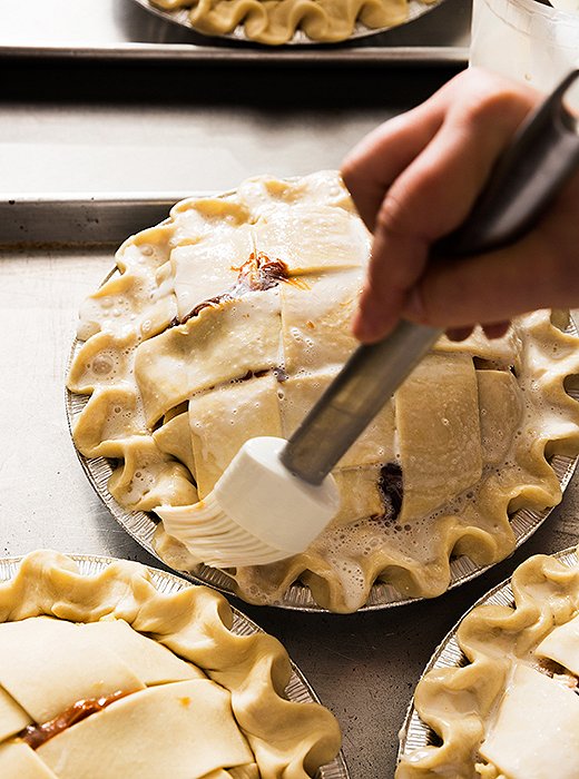 I loved painting all the pies with an egg glaze—it’s a loose wash, no need to be perfect here. The Four & Twenty Blackbirds glaze often has some half-and-half added in, which gives the baked crust a beautiful brown glow.
