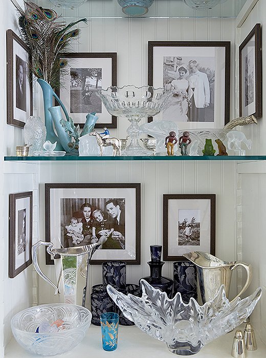 Built-in shelves serve as a place to display family photographs and prized possessions with shrinelike effect.
