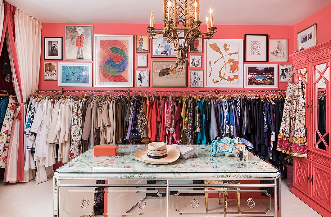 The closet features a mirrored island with an upholstered top under glass. The walls glow in a coral hue similar to that of Danielle’s favorite lipstick, Grace by NARS.
