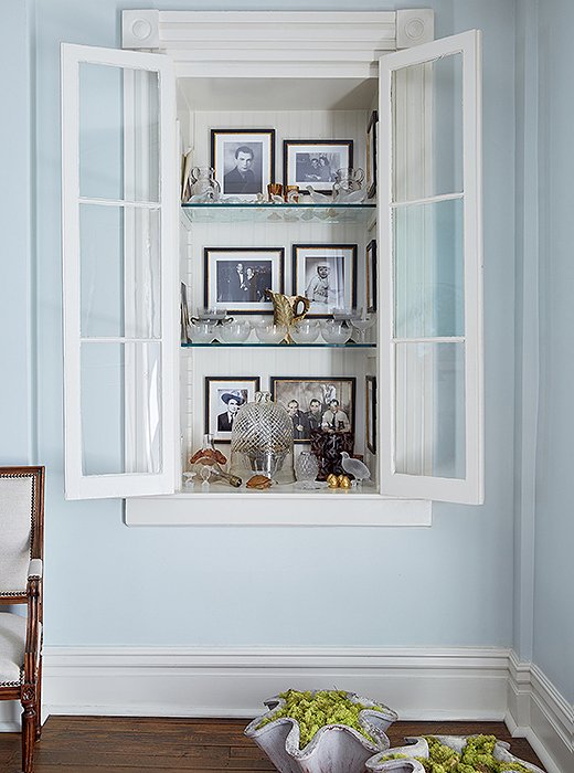 A second cabinet showcases images and mementos that speak to Jon’s family history.
