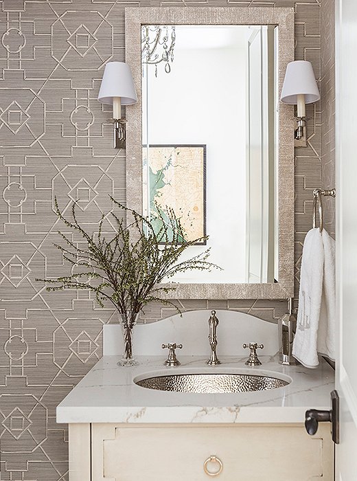 A powder room shines in shades of pearly gray. Photo by Julie Soefer.
