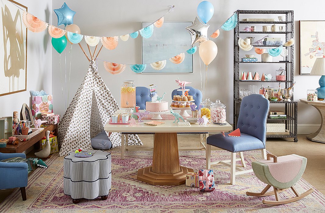 We stuck to a pastel palette to complement the tones of the Georgica Table and Jack Chairs, both by Bunny Williams Home. In a corner, a patterned tepee offers a perfect place to hide and play. And instead of surrounding the table with dining chairs, we added an ottoman, a children’s-size chair, and a rocker into the mix so that everyone has a comfy spot to perch.

