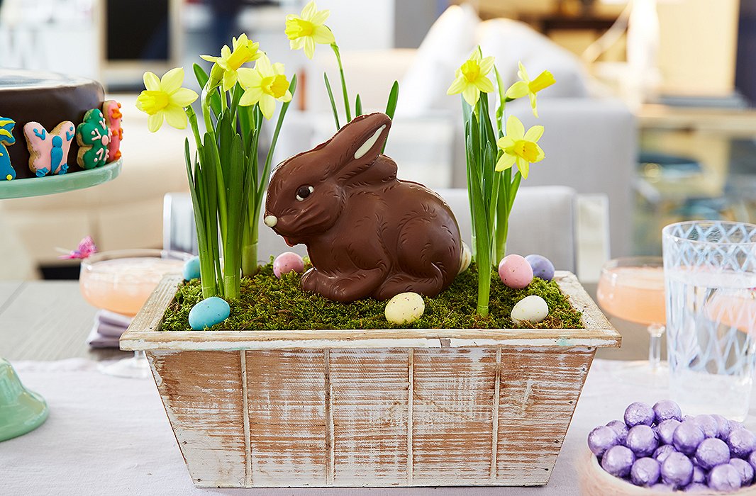 Bring the outdoors in with this whimsical DIY centerpiece. Modeled after a window box, it incorporates blooming daffodils and—what else?—a charming chocolate Easter bunny.
