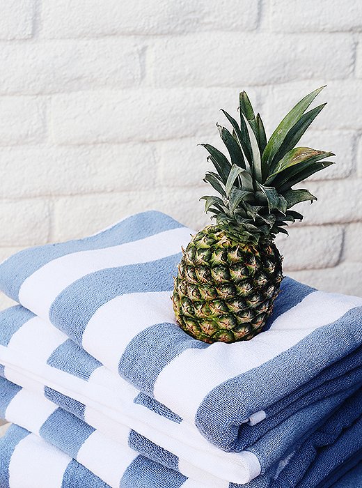 A stack of Cabana Stripe beach towels ready for its close-up.
