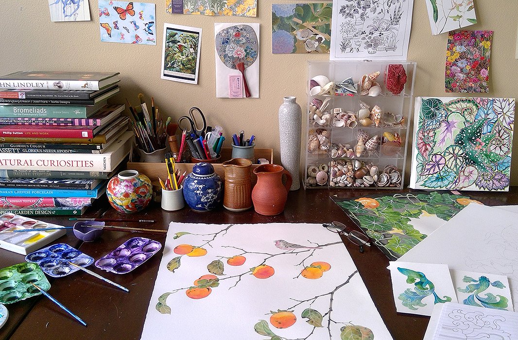 Gabby’s worktable brims with collected inspiration, including gardening books, ceramics, shells, and postcards. Photo courtesy of Gabby Malpas.
