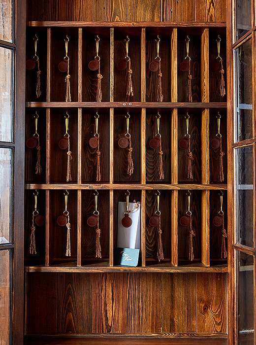 Guests are greeted at reception with a European-style key cabinet, a relic that provides atmosphere and a handy spot to sort mail.
