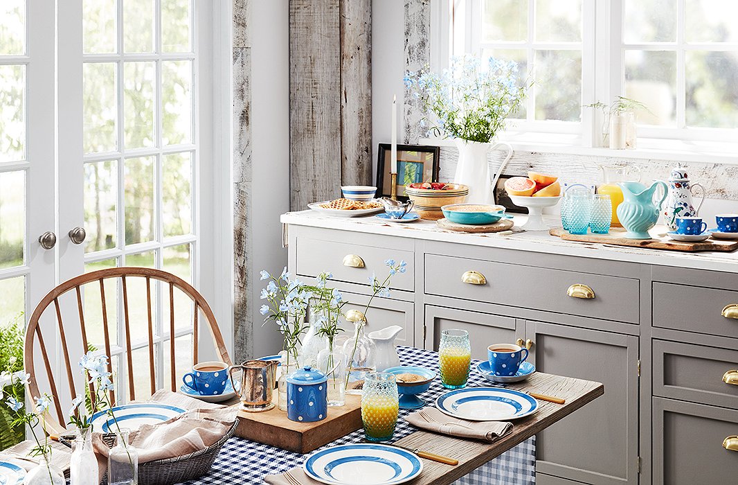 A simple table setting in a spectrum of blue hues sets a cheerful tone.

