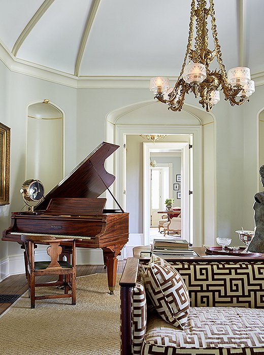 A ship’s light graces the piano in lieu of silver frames, casting a sunsetlike glow on the entire room when on. 
