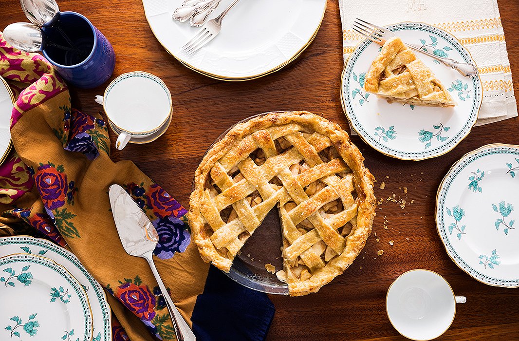 Laying out the pie, along with pieces destined for the Thanksgiving table: a blue cup made by a ceramist friend on Nantucket, a set of green-and-white Spode china given to me by my mother-in-law, and a table linen from my great-grandmother with her monogram, “M.H.”
