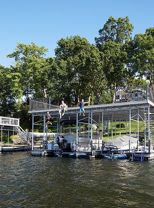 The extended Cosgrove family takes full advantage of the lake. “Sailing, kayaking, throwing the ball to the dog, jumping off the dock—they do it all,” Barbara says. “When the kids are 10 they’re allowed to have a little 10-horsepower boat they can go out on.”
