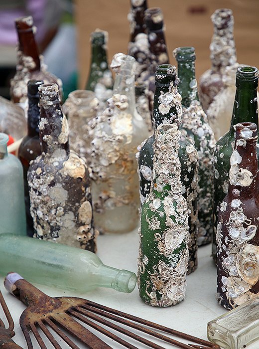 Saltwater-worn and barnacle-covered glassware is the perfect addition to a beach house—or anywhere else you want to add seafaring charm. 
