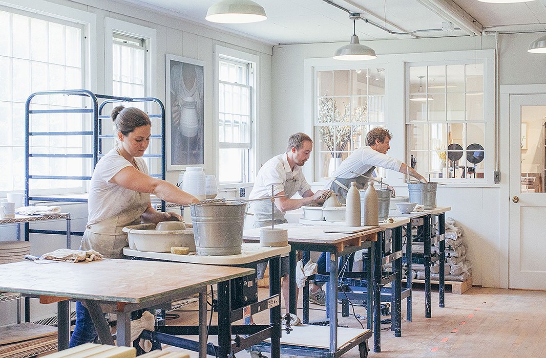 James and two fellow artists throw pottery in the Farmhouse studio. 
