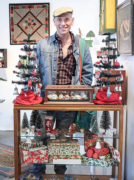 Bob stops for a snapshot while perusing the wares at an antiques shop. The designer began collecting antiques at the age of seven and now travels the world hunting treasures at flea markets, auctions, and estate sales.
