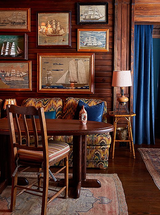 In the bar’s lounge, flame-stitch-covered sofas make an unexpected counterpoint to a salon-style display of nautical artwork, including framed wool-stitched scenes, or “sailor’s woolies,” found at Nantucket antiques shops.
