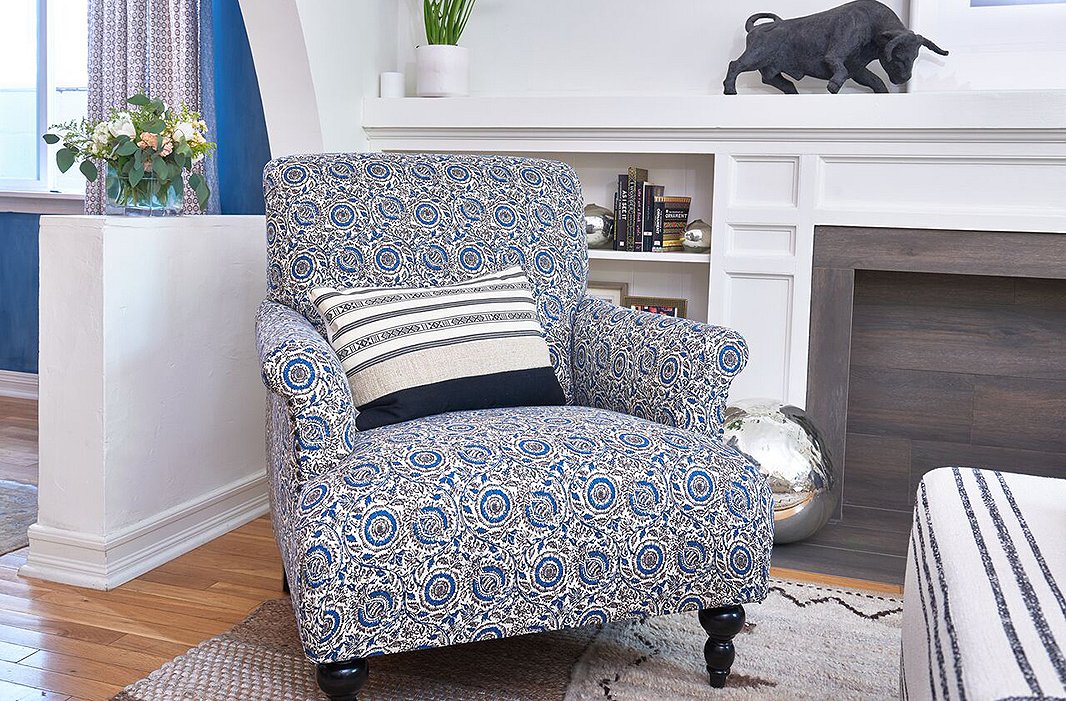 Covered in an intricate indigo floral, the handcrafted Grayson Club Chair is a lively update to a classic English design.
