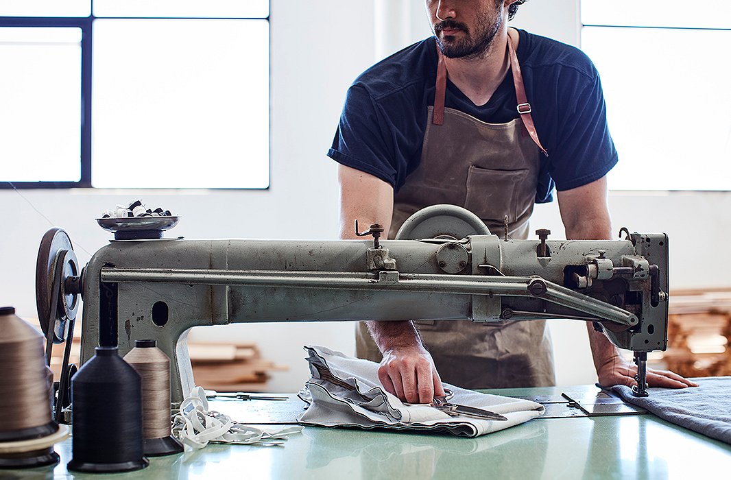 Craftsmen use a quilting machine to create Alden’s distinctive channel detailing.
