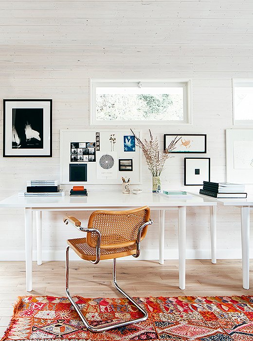 A board pinned with bits of inspiration graces the desk where Laura focuses best. 
