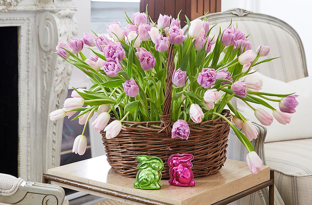 Try a new take on the Easter basket: Arrange tulips in low glass containers (using flower frogs so that the stems stand upright), then tuck them into a classic handled basket.
