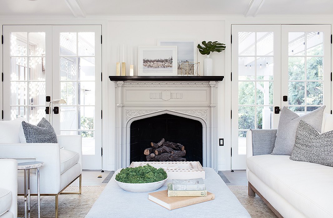 The touches of greenery are all the more vivid for being in a predominately white and cream room. Photo by Joe Schmelzer.
