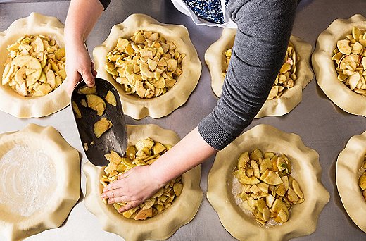 Once we spread the apples over the pie pan, we flattened them with our palms to ensure the top layer of lattice could lie evenly.
