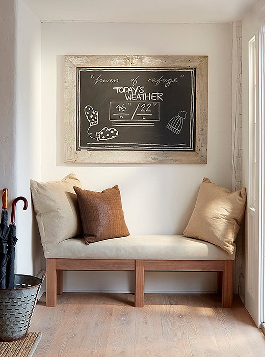 In the lobby, a chalkboard displays the day’s forecast above a bench ideal for taking off Wellingtons.
