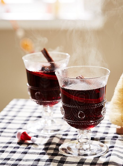 Offering a steaming cup of mulled wine is the perfect way to greet guests. 
