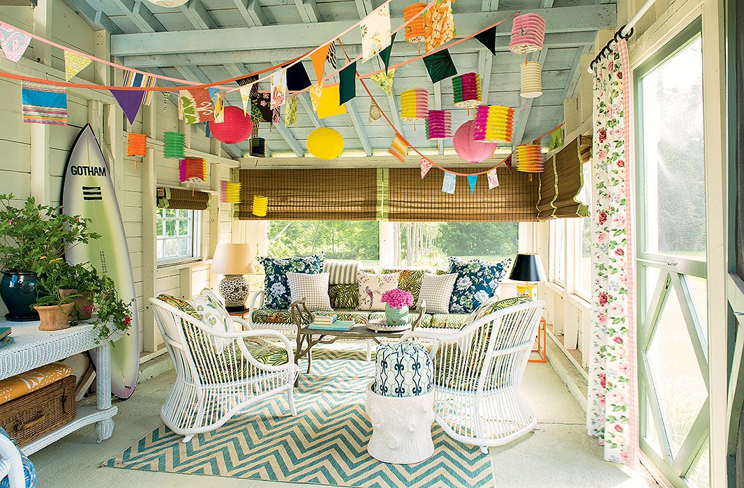 A pop of chevron anchors a sunny porch, accented with rose prints and gingham.
