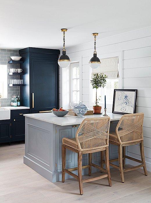 Kitchen stools offer a mod touch with a nautical twist, pairing perfectly with the clean look of the kitchen, which was designed by Will.
