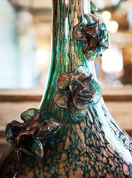 With its rich green and metallic hues and delicate detailing, this blown-glass lamp base is a true work of art.
