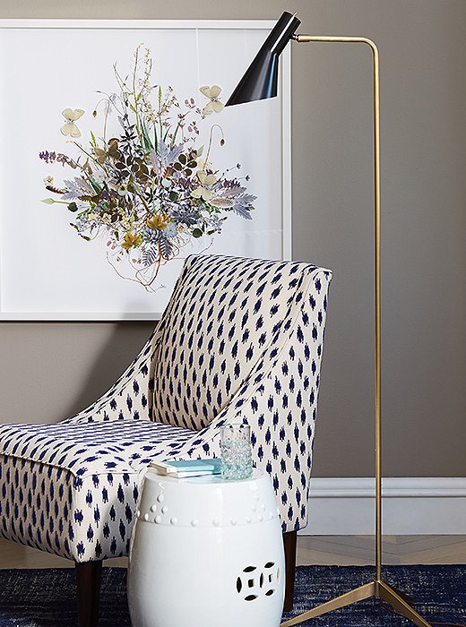 The Penelope Floor Lamp, available in black (shown), white, and brass finishes.

