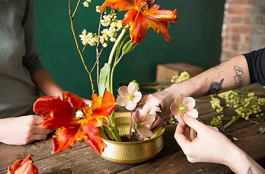 We snip some hellebore blossoms off a plant to add low layers of flowers.  